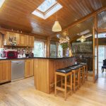 Light filled kitchen complet with island and aga cooker and rangemaster